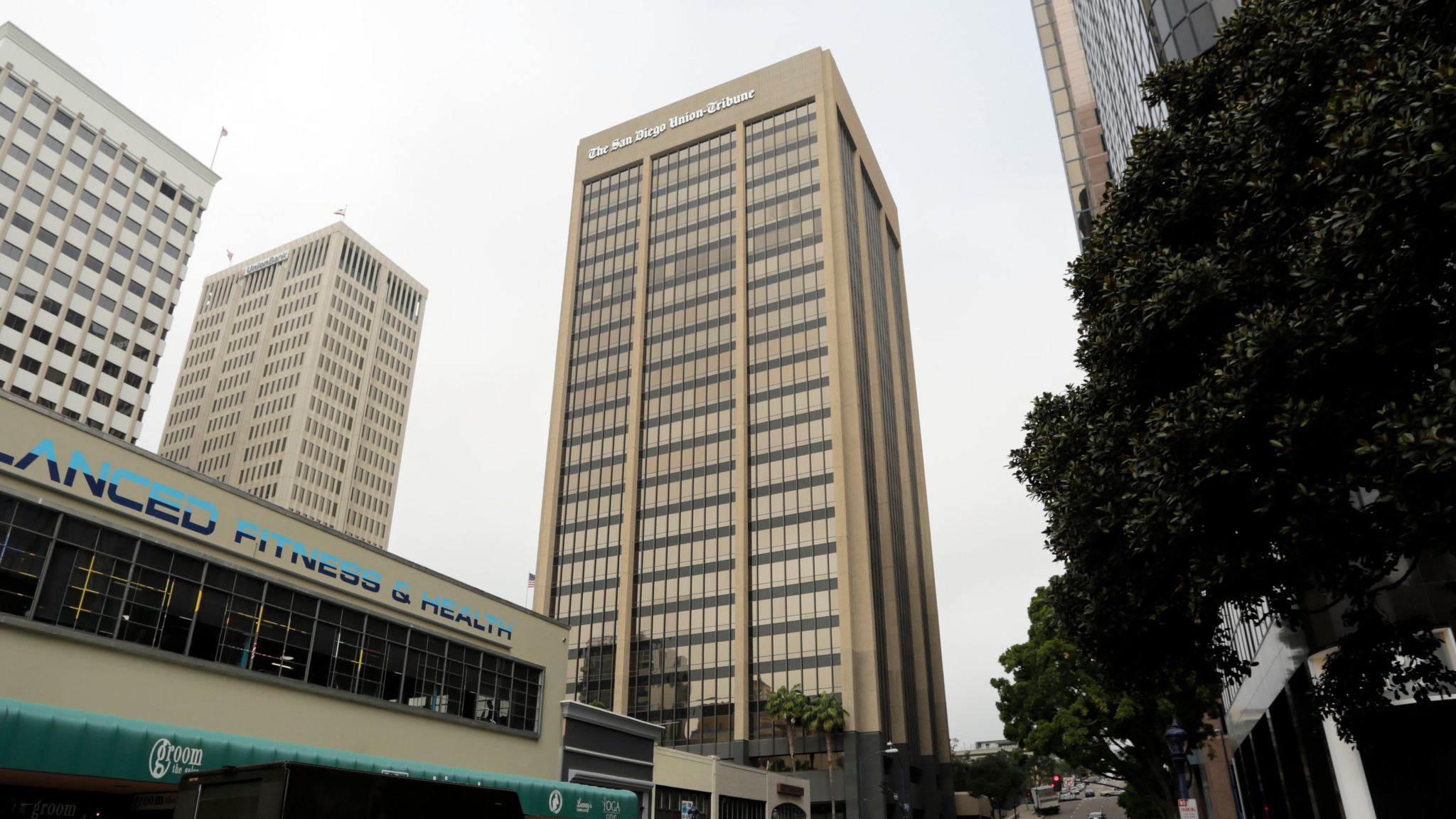 Two downtown highrises sell for $167M. Declining vacancies equal rising prices.